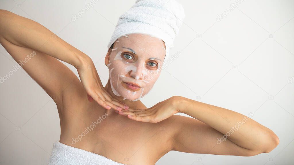 Woman with a white cosmetic mask on her face. Negative space or copy space for text.