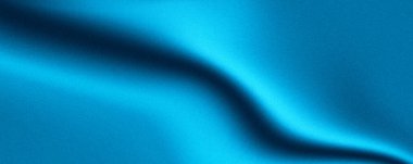 Dalgalı, koyu gölgeli, dokulu mavi kumaş bir derinlik ve hareket hissi yaratıyor..