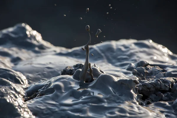 Splashing crater of a mud volcano. Active mud volcano in Gobustan desert, Azerbaijan