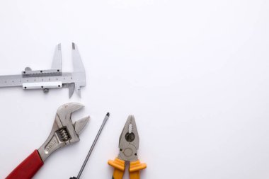 A variety of used tools on a light background