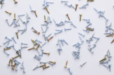 screws arranged on a light background.