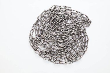A metallic chain with a shiny, industrial finish, coiled and displayed against a clean white background.