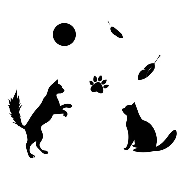Oyuncak siyah kedi siluetleri ay ve beyaz arka planda yapraklar