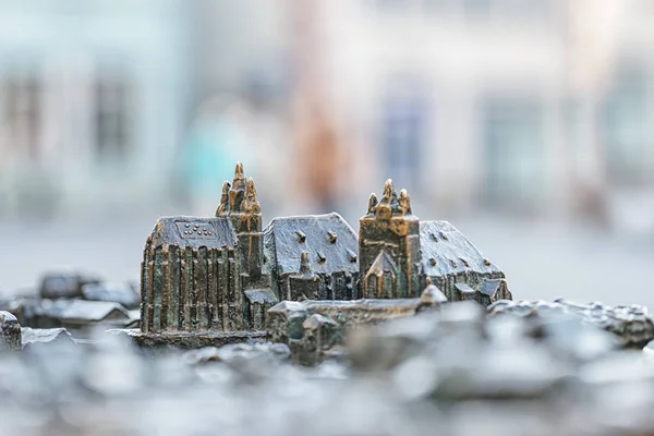 Small model of famous Cathedral and Severi church in Erfurt, Germany. Braille language. Blurred background