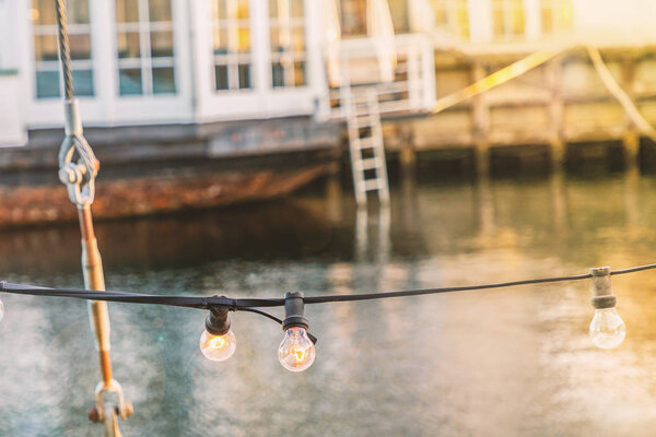 Details of old wooden boat and light bulbs line. Copenhagen, details