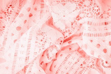 Modaya uygun ışık mercan rengi dantel kumaş. Çiçek deseni, ayrıntıları