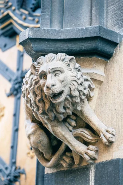 Stone statue lion at the facade of New City Hall in Munich, Germany. Details