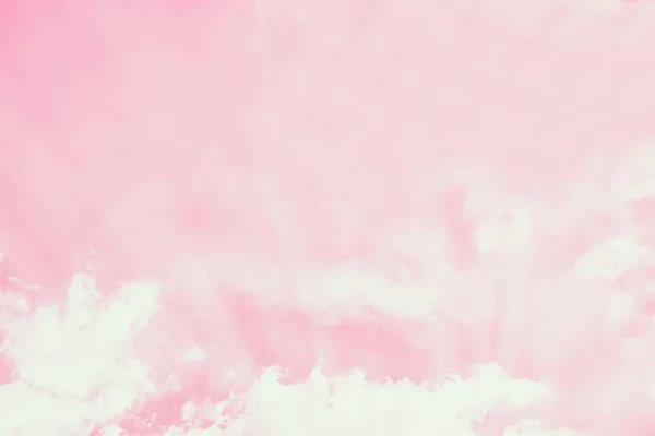 Light delicate pink sky background. Beautiful romantic sky with white clouds