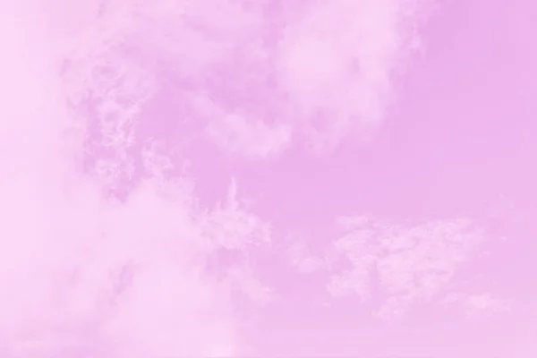 Light soft pink sky background. Beautiful romantic sky with cirrocumulus clouds