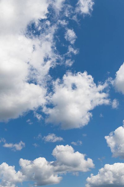 Beautiful white fluffy clouds on a blue sky background