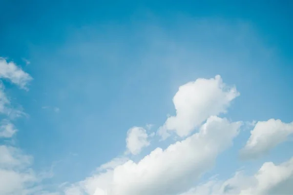 Blurred sky background, white clouds in the blue sky background