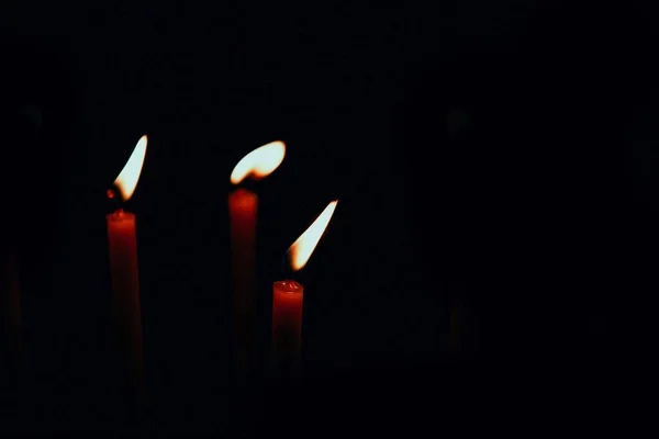 Thin Red Lighted Candles Black Background Copy Space — Stock Photo, Image