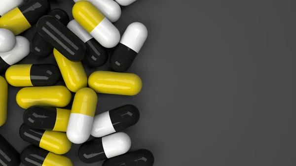 Pilha de cápsulas de medicamentos pretas, brancas e amarelas — Fotografia de Stock