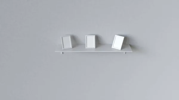 Three Blank White Photo Frames Standing White Shelf White Wall — Stock Photo, Image