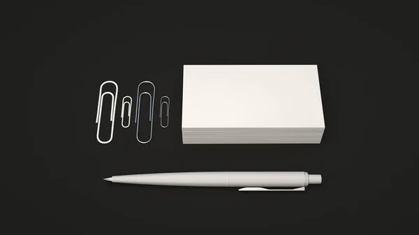 White business cards, paper clips and automatic ballpoint pen isolated on black background. Blank paper mockup. 3D rendering illustration.