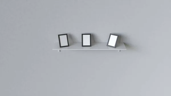 Three Blank Black Photo Frames Standing White Shelf White Wall — Stock Photo, Image