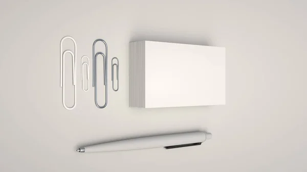 White business cards, paper clips and automatic ballpoint pen isolated on white background. Blank paper mockup. 3D rendering illustration.