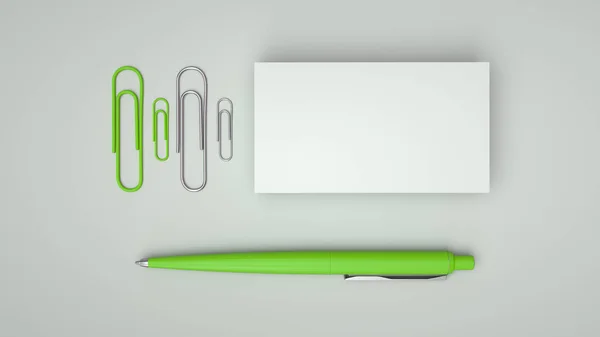 Witte Visitekaartjes Paperclips Groene Automatische Balpen Geïsoleerd Een Witte Achtergrond — Stockfoto