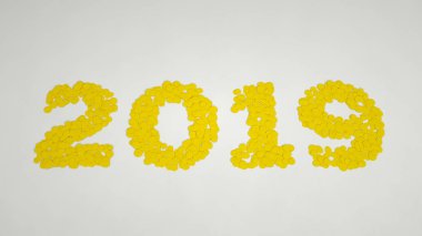 2019 number made from yellow confetti on white background. 2019 new year sign. 3D rendering illustration