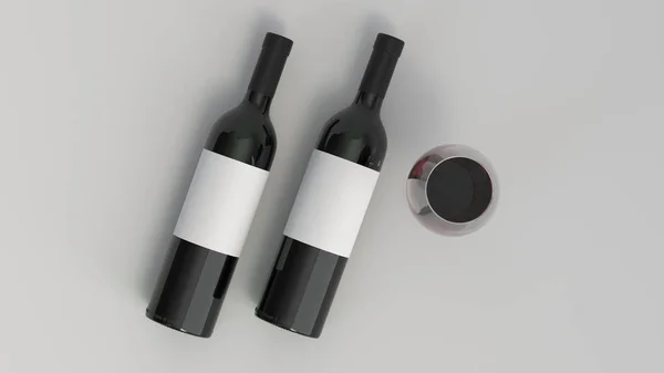 Макет из двух бутылок красного вина с бокалом — стоковое фото