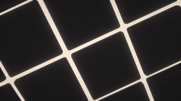 Golvend Oppervlak Gemaakt Van Zwarte Blokjes Met Witte Gloeiende Achtergrond — Stockvideo