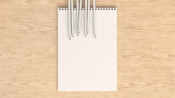 Notebook met witte potloden — Stockfoto