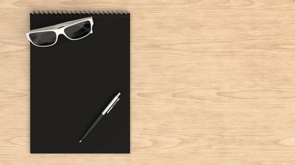 Notebook com óculos de sol e caneta — Fotografia de Stock