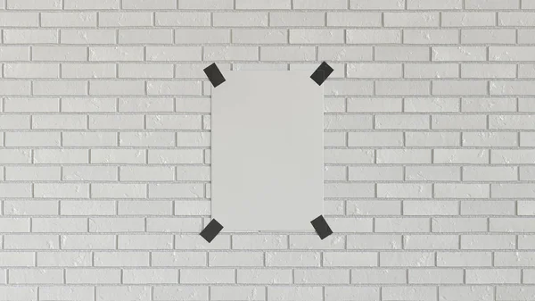 Blank white vertical poster taped to the brick wall