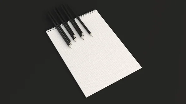 Poznámkový blok s černými tužkami — Stock fotografie