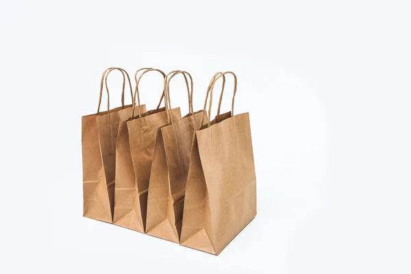 Kraft Bags White Background Row Sale Shopping Gifts — Stock Photo, Image