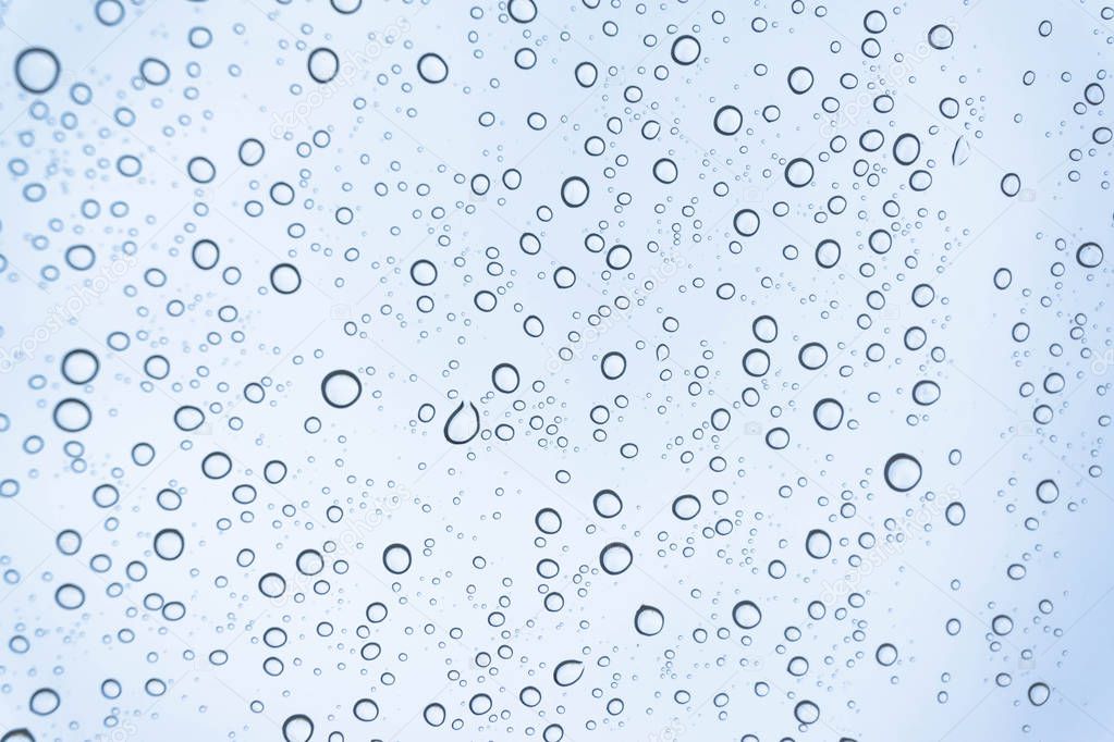 Rain on the window, natural skin of the rain The natural form of rainwater on a sky background.