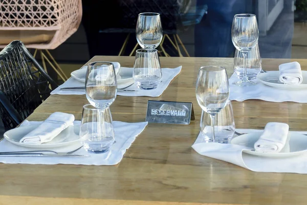 Table reserved for four people in a restaurant in Madrid Stock Picture