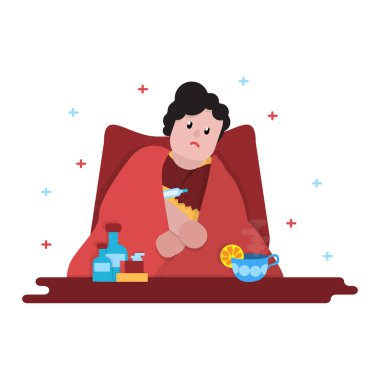 Genç adam hasta ve bir termometre ile oturuyor. Bir fincan güzel kokulu çay ve limon, ilaç şişeleri ve pill kutuları. Bir battaniyeye sarılmış.