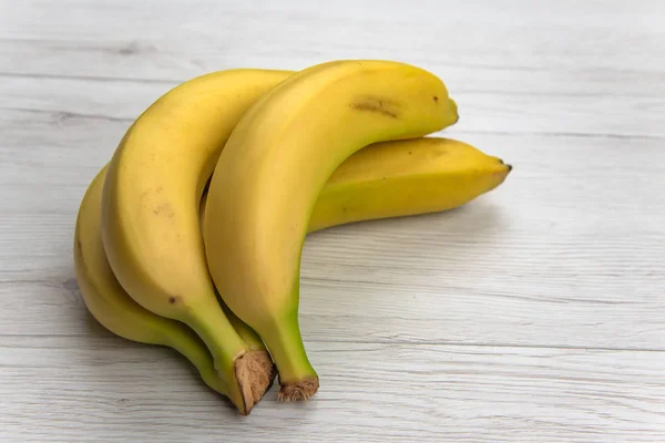 Bananas White Wood Table Isolated — Stock Photo, Image