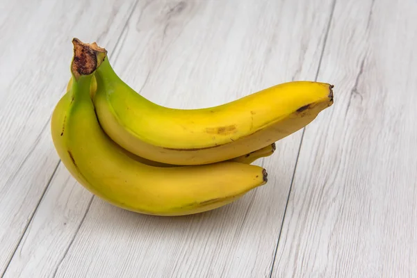 Bananas White Wood Table Isolated — Stock Photo, Image