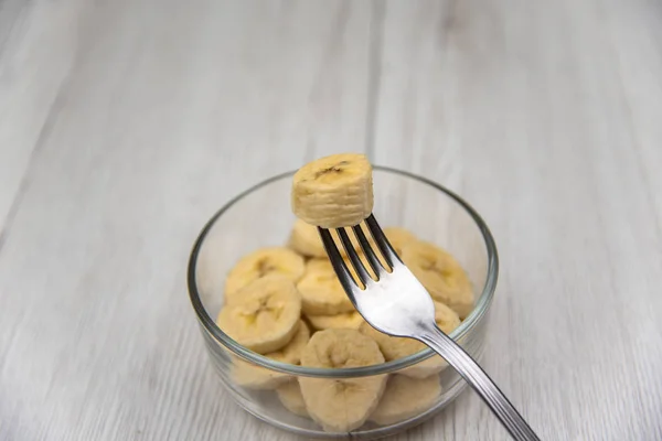 Raw Yellow Banana Fruit Slices Bowl Whit Fork White Wood — Stock Photo, Image