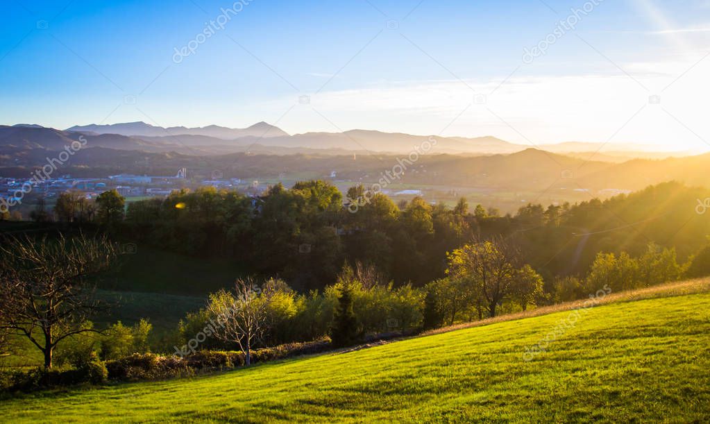 Sunset over the beautiful hills of the Piedmont region in Italy.