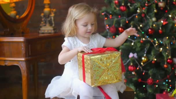 Beautiful Blonde Girl Waiting Surprise Opens Gift — Stock Video