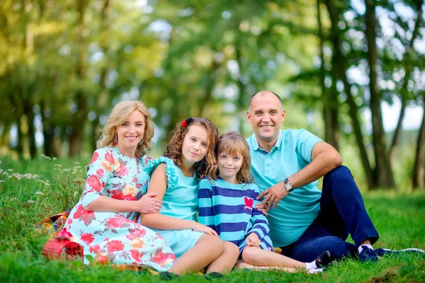 Happy Family Beautiful Autumn Park Sitting Grass Hugging Smiling — Stock Photo, Image