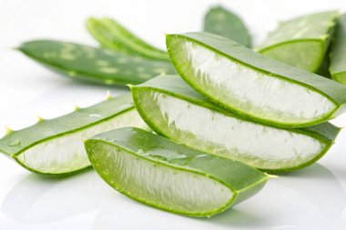 sliced aloe leaves with drops