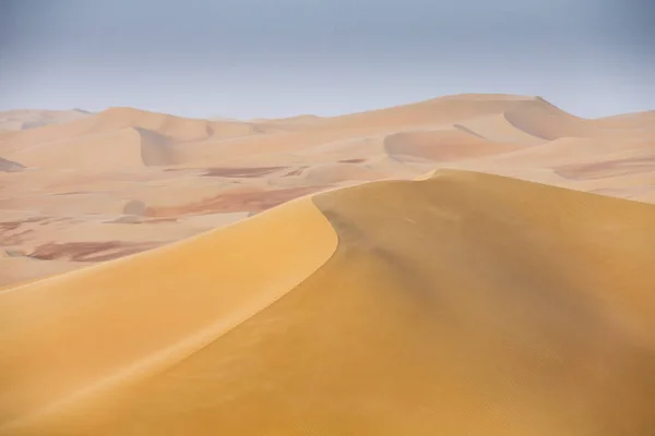 sand storm in Liwa desert during sunset