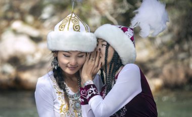 Lake Issyk-Kul, Kurgyzstan, 6th September 2018: young kyrgyz ladies in a nature clipart