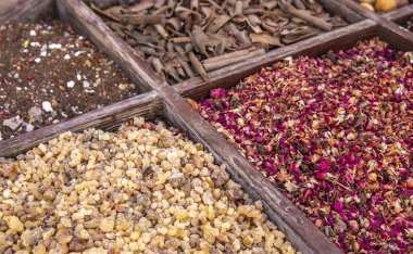 dried frankincense and other spices on market stall in Al Seef, united arab emirates clipart
