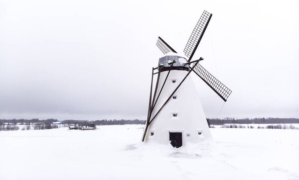 old windmill in estonian winter landscape