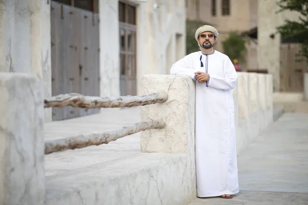 arab man in traditional costume in old Al Seef part of Dubai, United Arab Emirates