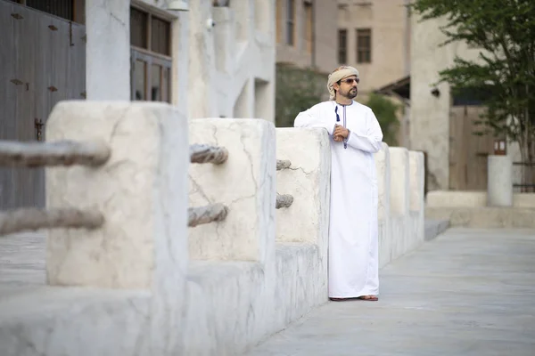 arab man in traditional costume in old Al Seef part of Dubai, United Arab Emirates