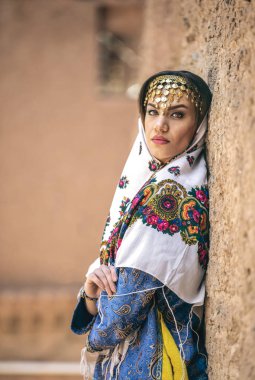 young beautiful Iranian lady in traditional clothing in village of Abyaneh clipart