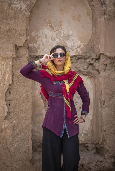 young beautiful Iranian lady in old village in Iran
