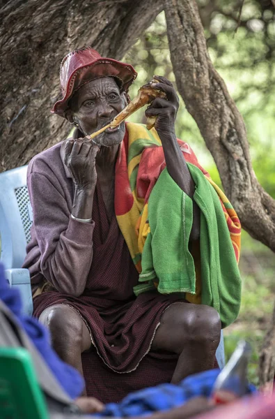 Same, Tanzania - 4th June, 2019: old man chewing on bone