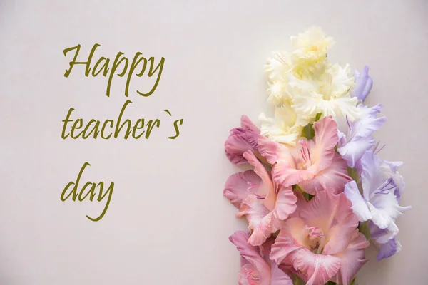 Happy teacher`s day. Happy teachers day. Greetings card for teacher\'s day. Postcard with colorful gladiolus
